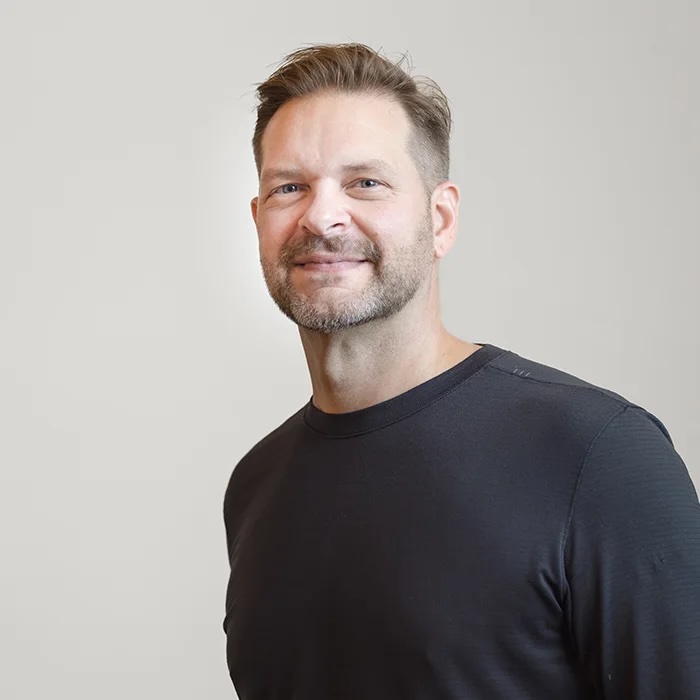 Jon Clark — casual headshot, black tee